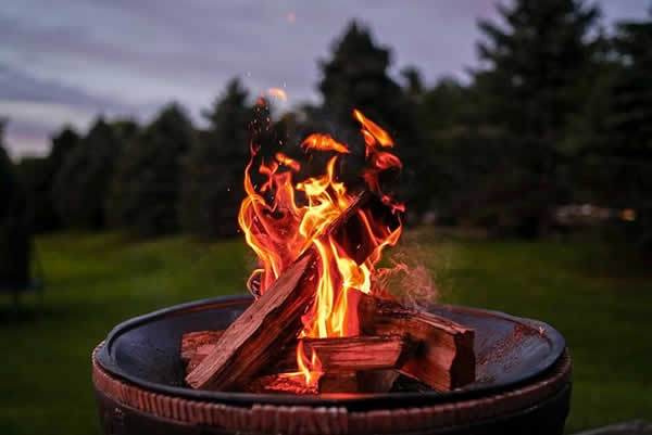 burning logs in outdoor fire pit