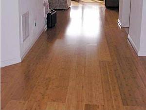 hardwood flooring installed lengthwise perpendicular to entrance